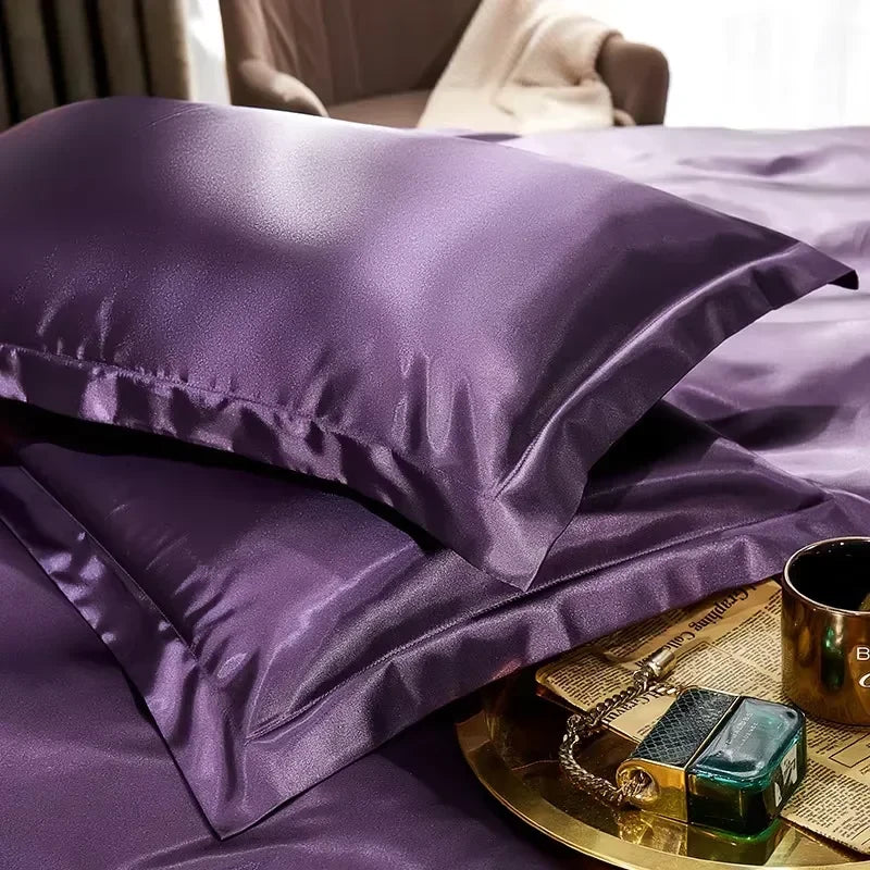 Purple smooth satin-feel pillowcase set on a bed