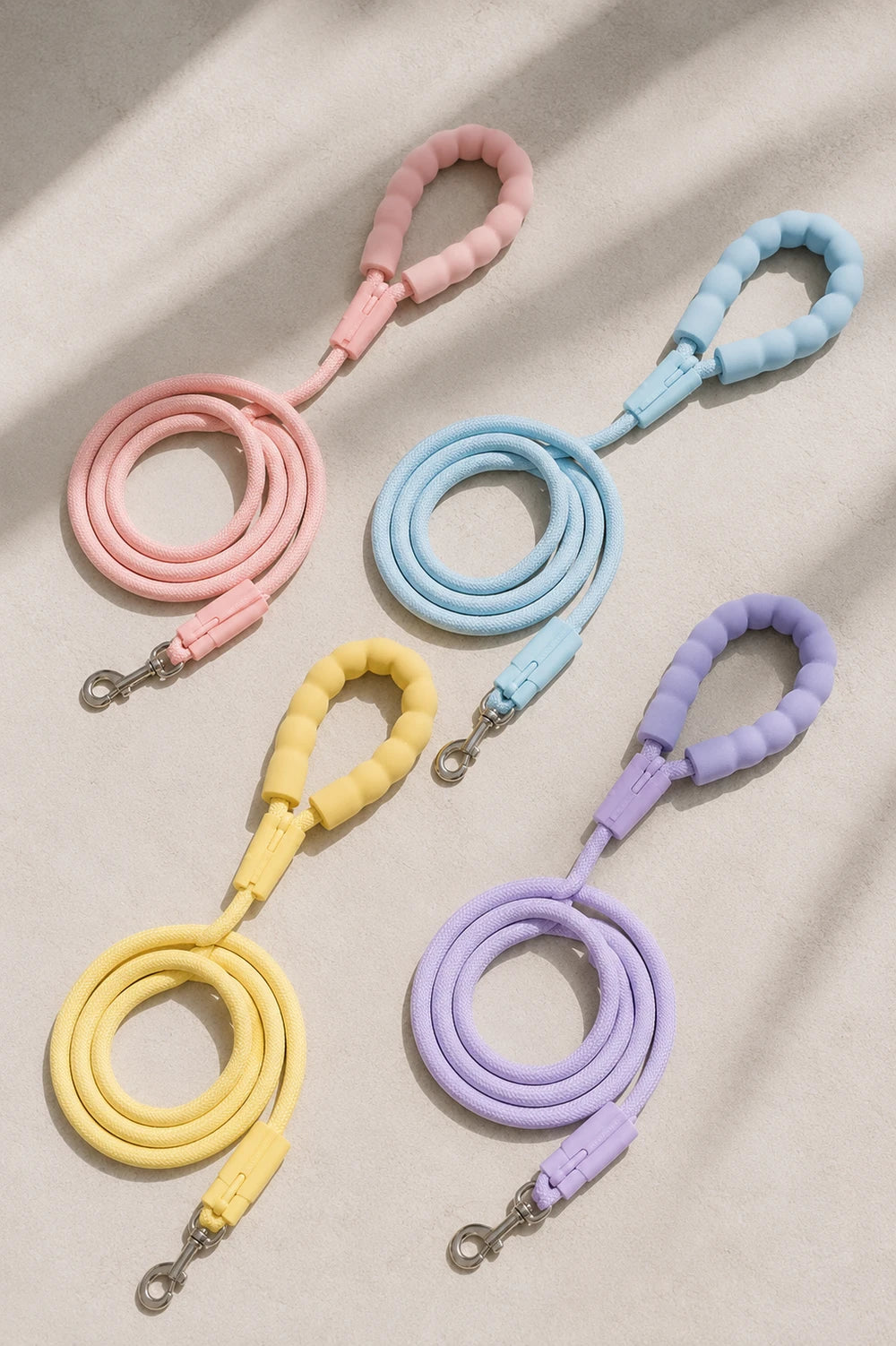 Pink, blue, yellow and purple pastel rope dog leashes with padded handles and metal clasps
